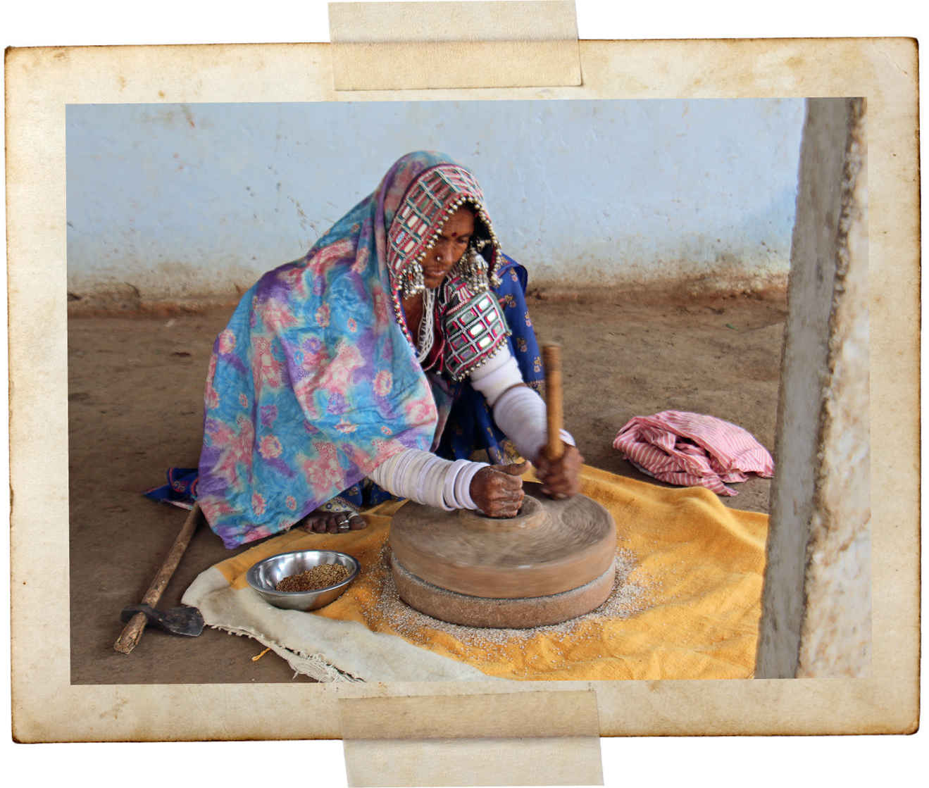 A Banjara woman in Andhra grinds millet for bread.